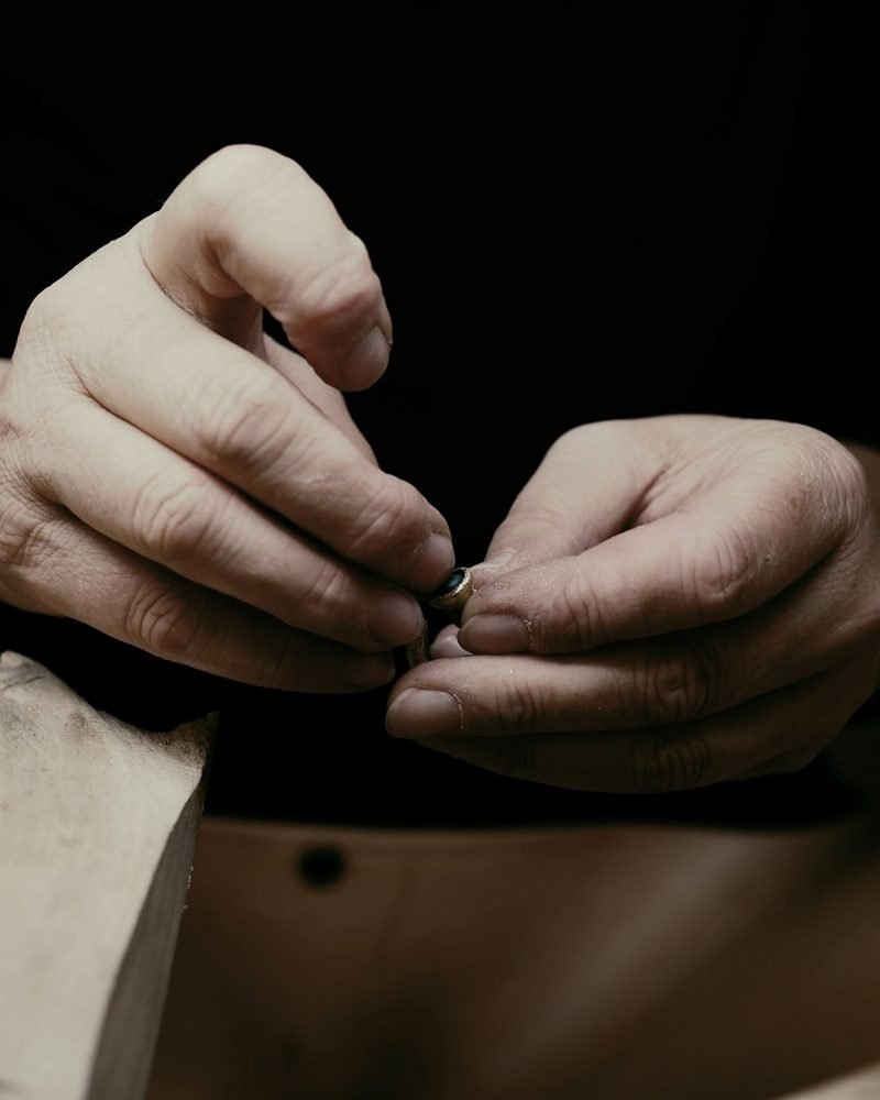 Close-up of a jeweller shaping a ring by hand